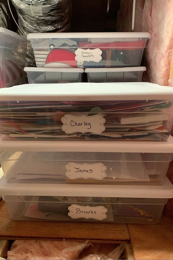 paper clutter with labeled boxes attic