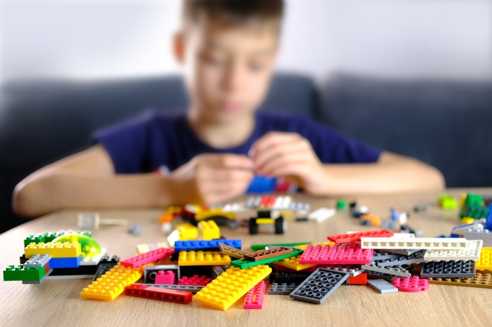 A view of a child playing with lego