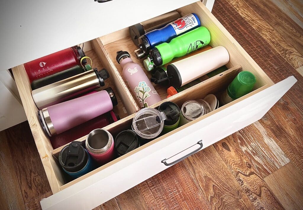 A top view of water bottles kept inside a drawer