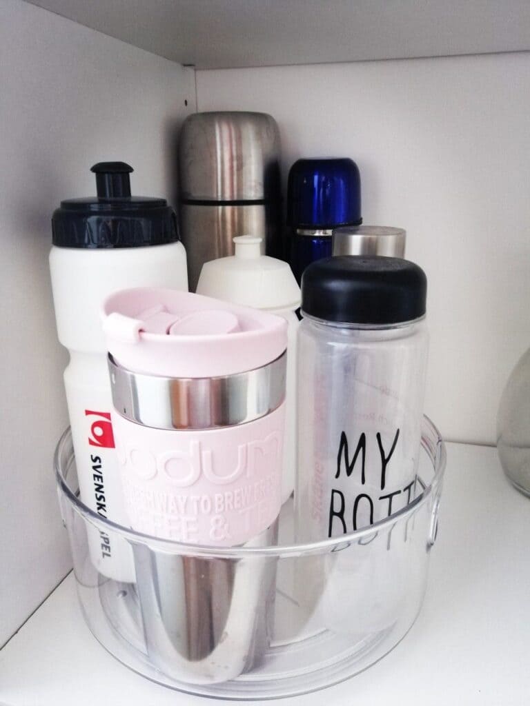 A view of a lazy susan holding water bottles