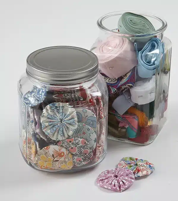 A view of cute fabric ties stored inside glass jars