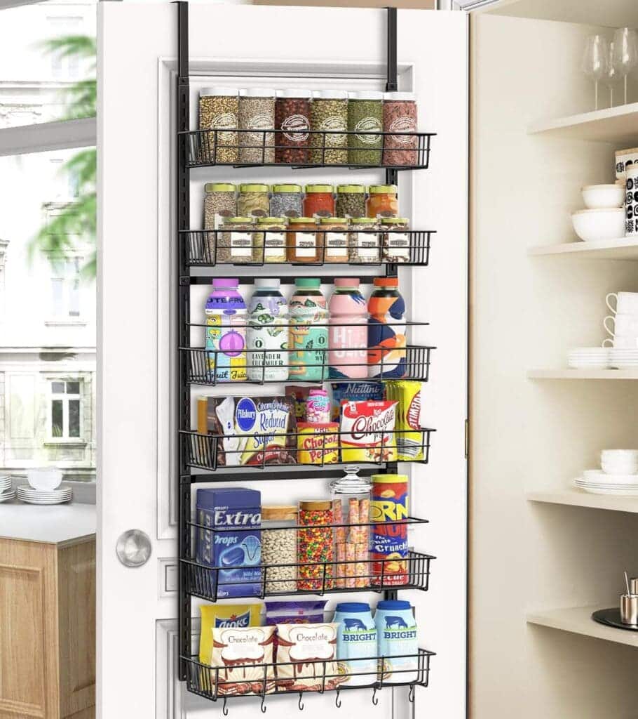 A view of water bottles and other item kept inside a back of the door pantry