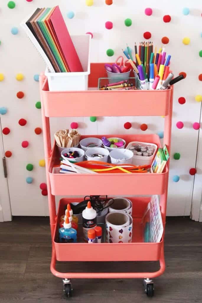 art cart in pink color colorful stationary placed in art box