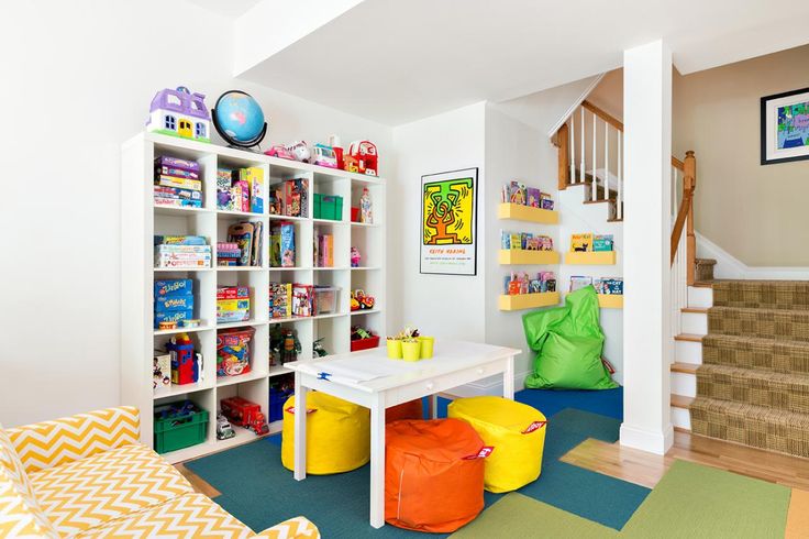 bean bags in yellow and orange color toys arranged in shelves