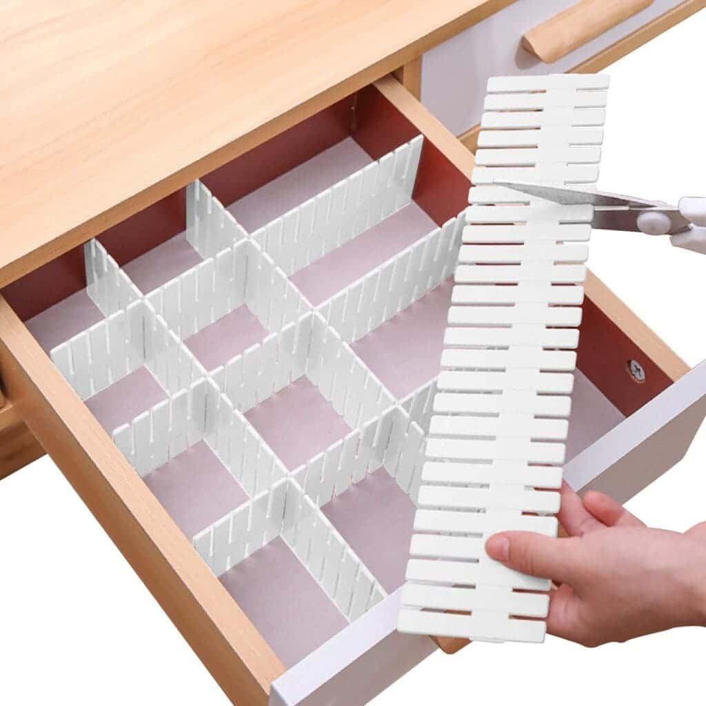 drawer divider in white color someone cutting it with scissor