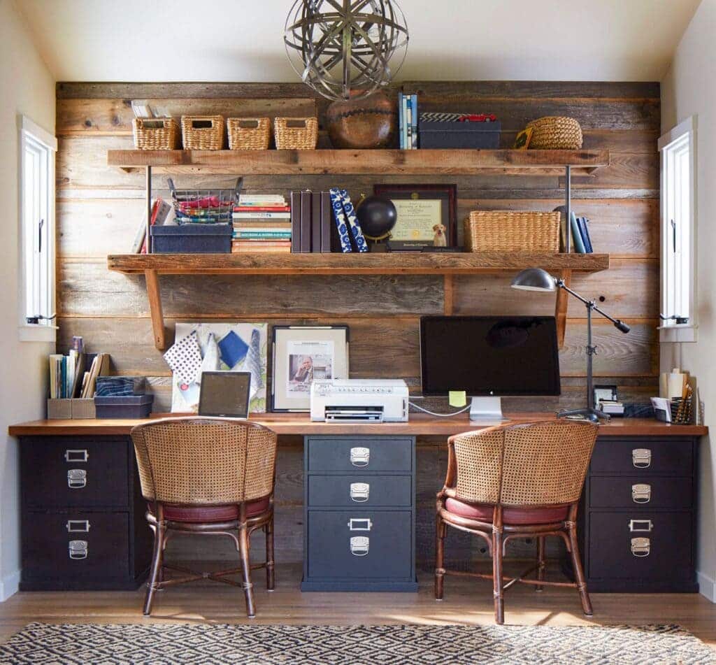 floating shelves in an office setup wooden chairs monitor placed on desk