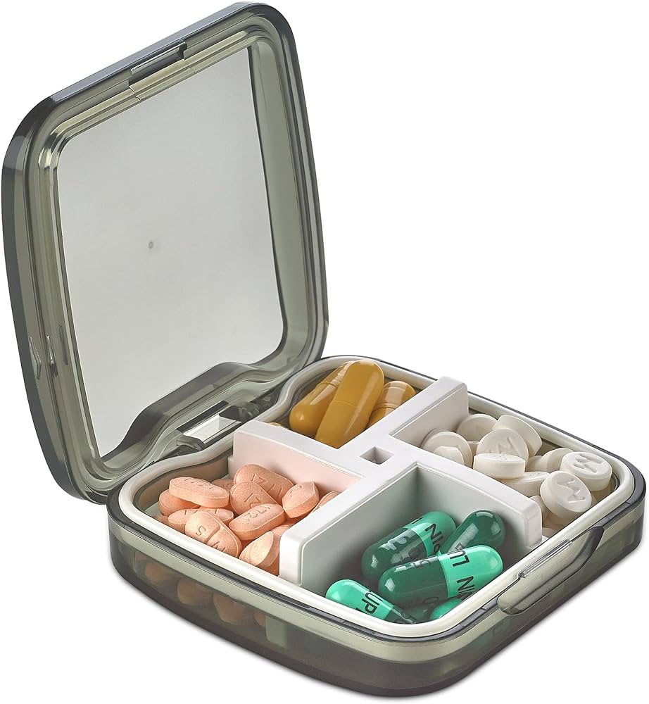 portable medicine caddy in grey color with pills organized in it