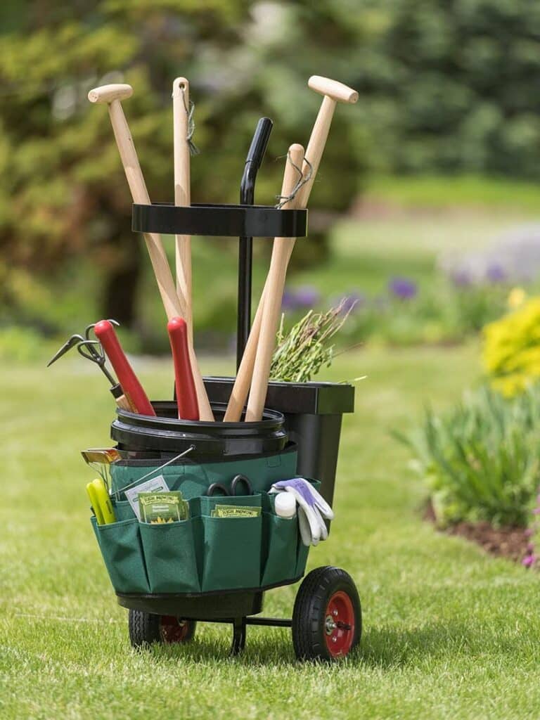 tool caddy in green and black color, gloves, scissors, pruning tools arranged in it