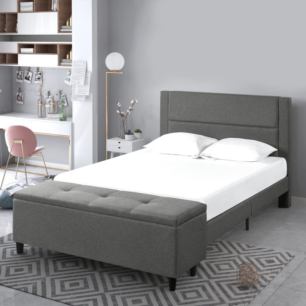 A view of a grey Wanda Upholstered King Size Bed with white sheets