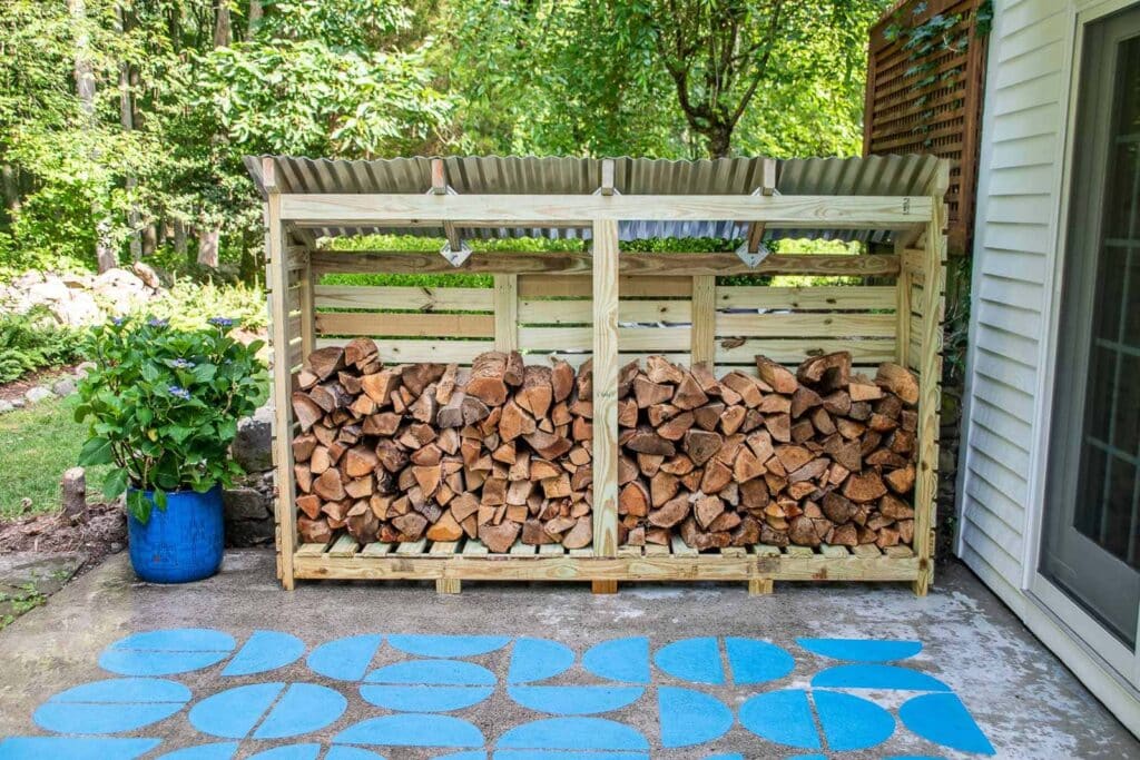 outdoor shed wirh wooden logs arranged in it