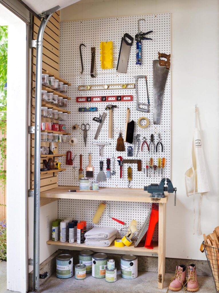 paint items garden tools arranged on pegboard