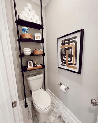 A view of a ladder for storage over a toilet