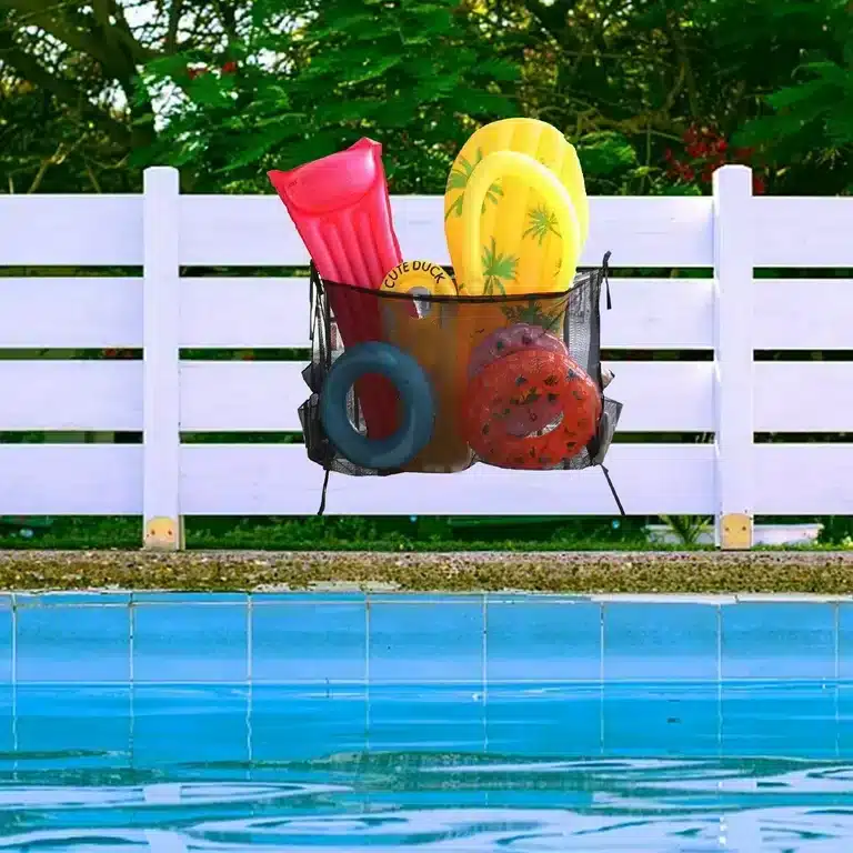 A view of a mesh bag holding the pool acccessories by the pool side