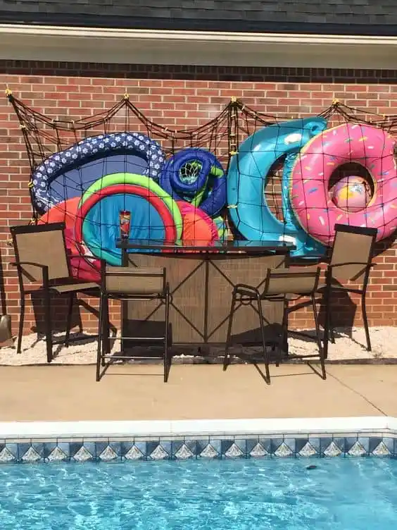 A view of a net storing the swimming equipment by the poolside