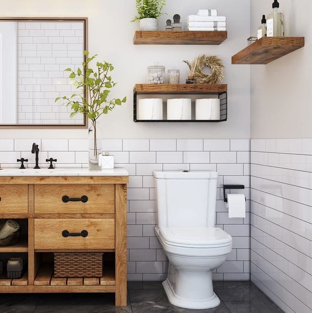 A view of a toilet with an over the toilet storage