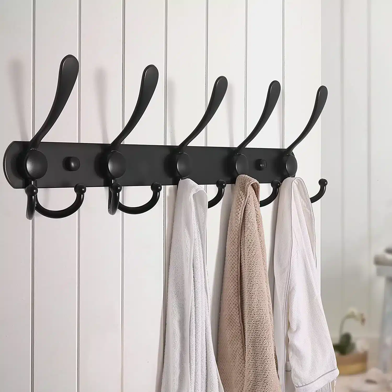 A view of a wall hook with clothes on