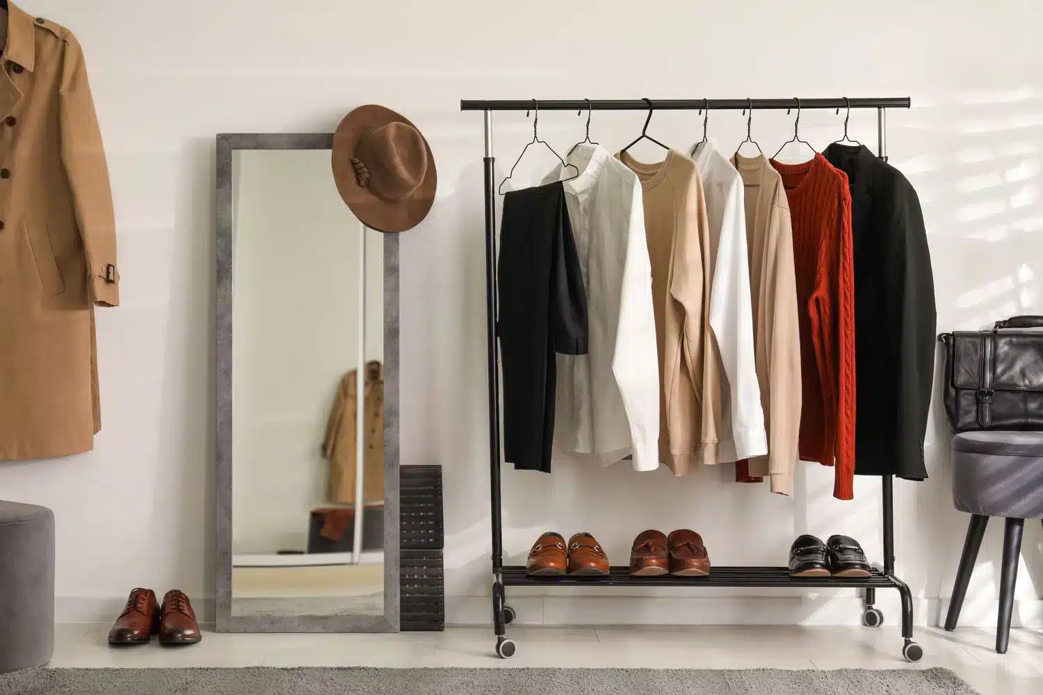 A view of an arranged closet space with a mirror on the side