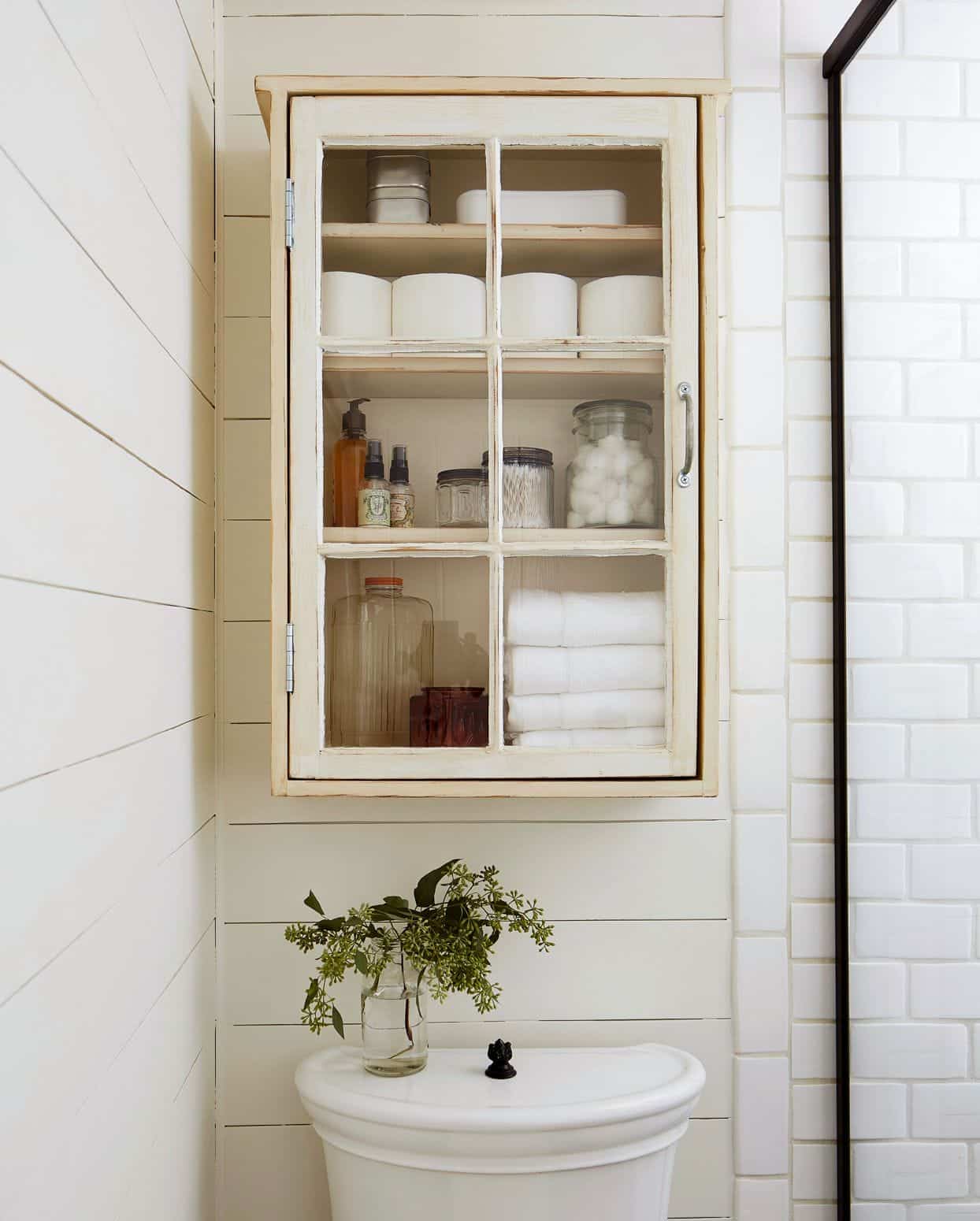 A view of the corral clutter in a cabinet above a bathroom