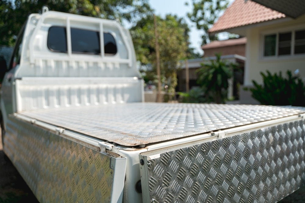 A close view of a silver truck bed for storage