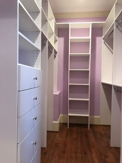 A view of a custom closet inside a basement