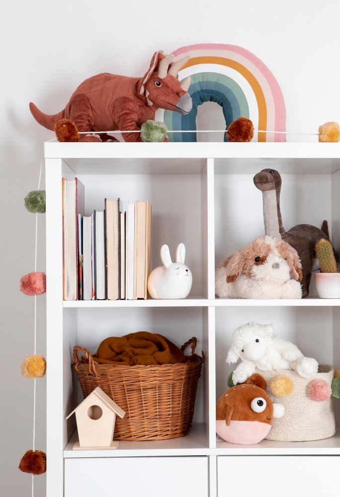 A view of a small cubby with toys stored inside