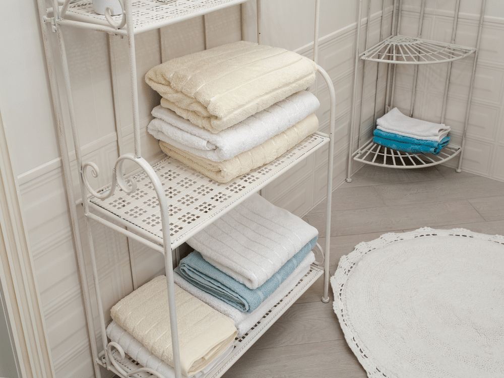 A view of a bathroom space with towels folded